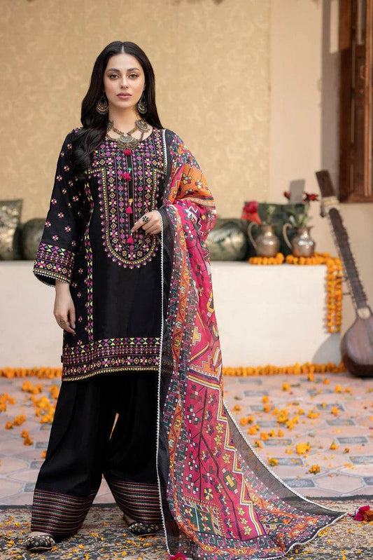 Black embroidered lawn suit with shuttle laces and tilla dori neckline, featuring a colorful lawn net dupatta and lawn trousers
