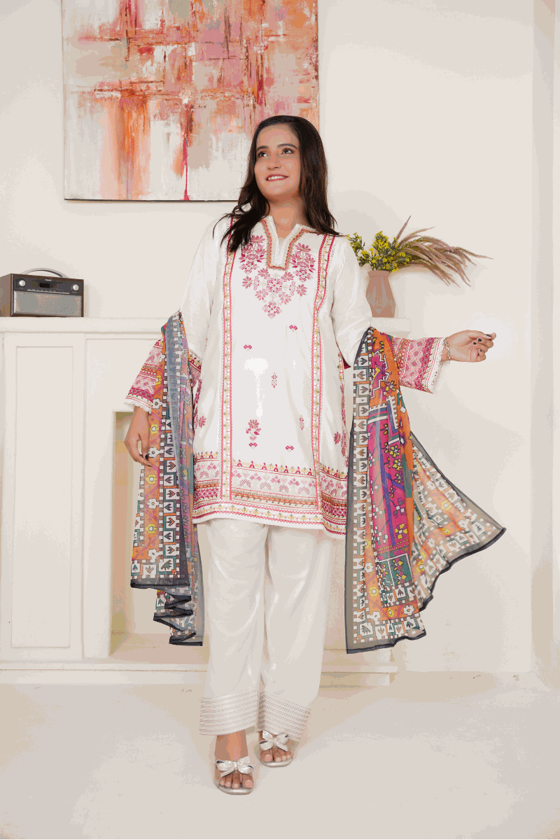 Woman wearing a 03-piece lawn embroidered suit with a white shirt, printed lawn net dupatta, and white lawn trousers.